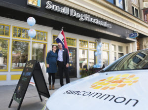 Duane Peterson, President and co-founder of SunCommon and Solar Organizer Els Van Woert stand outside of SunCommon's new store, located inside Small Dog Electronics in downtown Rutland, on Wednesday Sept. 24, 2014. SunCommon announced their launch into Rutland county bringing affordable residential solar to homeowners with no upfront cost.